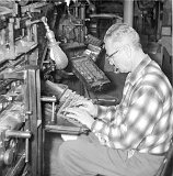 Monticllo Messenger Publisher, Clarence Wittenwyler-Dec. 31, 1911 - November 23, 1975-working at the linotype keyboard.